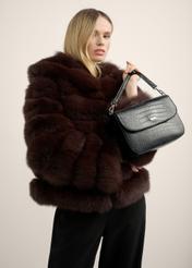 Black croco women's handbag TOREC-1262-9G(Z26), view of the product in the model's hand, on a light background.