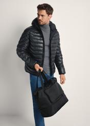 Black men's bag TORMN-0369-99(Z25), diagonal view of the product on the model, half of the silhouette visible.