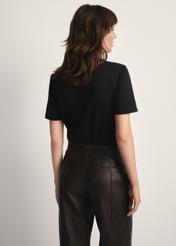 Black women's T-shirt TSHDT-0143-99(Z25), back view of the product on the model. Half of the silhouette visible.