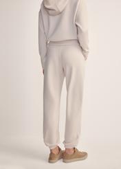Light beige women's trousers SPODT-0117-80(Z25), back view of the product on the model. Half of the silhouette visible.