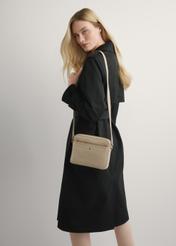 Beige small leather women's handbag TORES-1269-1B(W26) - front view of the product, on a model, on a light background.