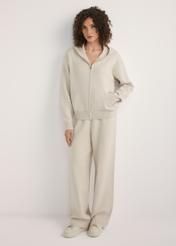 Beige women's hooded sweatshirt BLZDT-0120-1A(W26), front view of the product on the model. Full body visible.