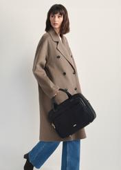 Black roomy women's laptop bag TOREN-0320-99(Z25) - front view of the product on a model against a white background. The entire silhouette is visible from the side.