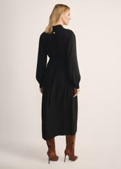 Women's black long-sleeved dress SUKDT-0246-99(Z25), back view of the product on the model. Full body visible.
