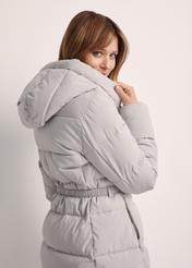 Long light gray women's jacket KURDT-0602-66(Z25), product view from the back on the model. Half of the silhouette visible.