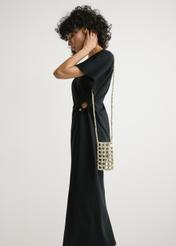 TOREC-1145-0C(W26) Beaded Phone Case - slightly diagonal view of the product, on a model against a light background. Knee-length silhouette visible.