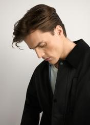 Black men's transitional jacket KURMT-0419-99(W26) - close-up of detail, on a light background.