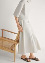 Women's flip-flops with braid in cool brown color BUTYD-0904D-1K(W26), side view of the product on the model's feet.