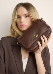 Small brown women's handbag TOREC-1249-1H(Z26), view of the product in the model's hands, on a light background.