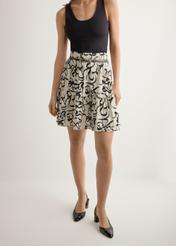 Women's cream patterned skirt SPCDT-0128-1P(W26), front view of the product on the model. Half of the silhouette visible.