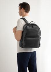 TORMS-0526-99(Z26) men's black leather backpack - front view of the product, modeled on a light background. Half-length silhouette visible.