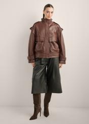 Women's burgundy oversize leather jacket KURDS-0644-4D(Z26), front view of the product on the model. Full body visible.