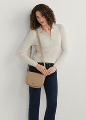 Beige leather semi-circular messenger bag TORES-0972F-1B(W26), product view on model's shoulder, against a light background.