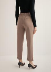Women's trousers with a crease in a cool beige color SPODT-0098-1K(Z26), view of the product from the back on the model, half of the silhouette visible.