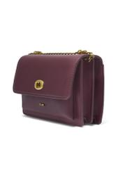 Small burgundy women's handbag with an elegant clasp TOREC-1322-4D(Z26), diagonal product view on a white background.