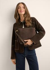 Brown suede women's handbag with studs TORES-1385-1I(Z26) - front view of the product, held by the model, against a light background. Half of the silhouette is visible.