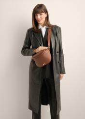 Large women's waist bag in light brown color TOREC-1266-1G(Z26), product view on the model's silhouette, on a light background.