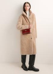 Elegant red women's handbag TOREC-1251-4C(Z26); angled view of the product shown on a model. Full-body view.