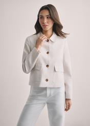 Light beige women's linen jacket KURDT-0652-1A(W26), front view of the product on the model. Half of the silhouette visible.