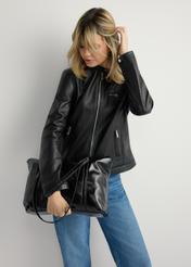 Black women's shopper bag TOREC-1206-9F(W26), product view in model's hand. Half of silhouette visible.