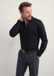 Black elegant men's shirt KOSMT-0339-99(Z25), front view of the product on the model. Half of the silhouette visible.