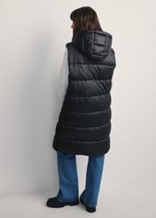 Black insulated women's vest KAMDT-0028-99(Z25), product view from the back on the model, the entire silhouette is visible.