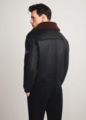 Men's brown aviator-style sheepskin coat KOZMP-0007-1I(Z26) - back view of the product modeled on a white background. Knee-length silhouette visible.