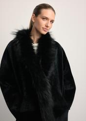 Black leather double-sided women's sheepskin coat KOZDS-0093-1396(Z25), close-up of the product from the front on the model.
