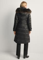 Black women's winter jacket with natural fur KURDT-0618-99(Z25), product view from the back on the model, the whole silhouette is visible.