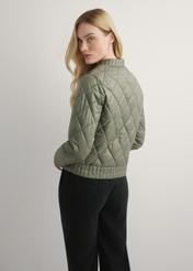 Women's transitional khaki jacket KURDT-0564A-55(W26), back view of the product on the model. Half of the silhouette visible.