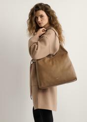 Large camel-colored women's handbag TOREC-1199-1D(W26), product view on model's shoulder. Half of silhouette visible.