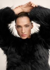 Black short natural women's fur coat FUTDF-0114-99(Z26), close-up of the product on the model's silhouette.