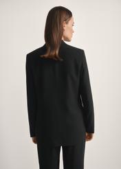 Women's black blazer ZAKDT-0031A-99(W26), back view of the product on the model. Half of the silhouette visible.