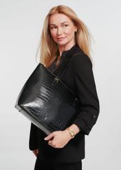 Elegant women's shopper bag TOREC-0953A-97(Z25), product view on the model. Half of the silhouette visible.