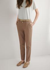 Women's camel trousers SPODT-0120-1D(W26), front view of the product on the model. Half of the silhouette visible.