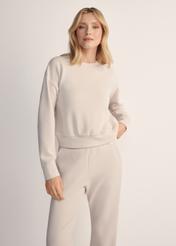 Light beige women's sweatshirt BLZDT-0119-80(Z25), front view of the product on the model. Half of the silhouette visible.