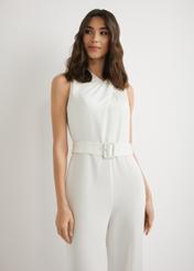 Cream women's jumpsuit KOBDT-0012-0B(W26), front view of the product on the model. Half of the silhouette visible.