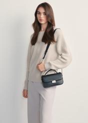 Women's black messenger bag TOREC-1066-99(Z25) - front view of the product on a model, against a white background. Knee-length silhouette visible from the side.