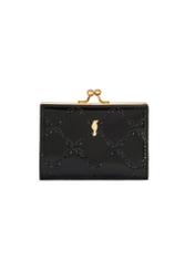 Small black women's wallet with monogram POREC-0422-98(Z25), front product view on white background.