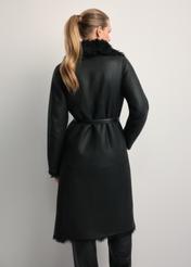 Black double-sided women's sheepskin coat KOZDS-0091-1395(Z25), back view of the product on the model. Half of the silhouette visible.