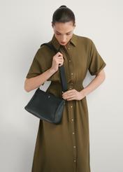 Women's black leather messenger bag TORES-1214-9I(W26), front view of the product on a model, half of the silhouette visible.