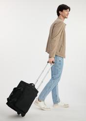 Black travel bag on wheels TORMN-0347-99(W25), product view from the side. The entire silhouette of the model is visible.