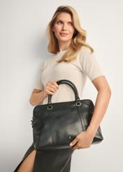 Black women's laptop bag TOREC-1130-99(W26), product view from the front on the model, half of the silhouette visible.