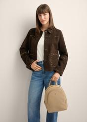 Beige leather women's backpack TORES-1355-1B(Z26), front view of the product on a model. Half of the silhouette visible.