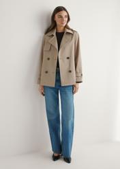 Beige women's short jacket KURDT-0556-1C(W26), front view of the product on the model. Full body visible.