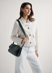 Classic black women's handbag TOREC-1124-99(W26), product view on model's shoulder. Half of silhouette visible.