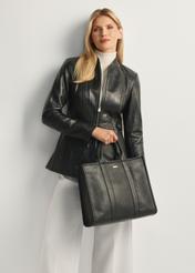 Women's leather handbag TORES-1145-99(Z25), front view of the product on the model, half of the silhouette visible.