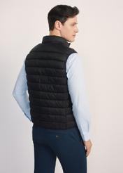 Black quilted men's vest KAMMT-0006-99(Z25), product view from the back on the model. Half of the silhouette visible.