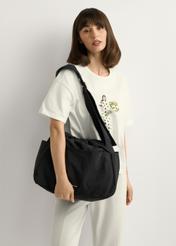 Black nylon bucket bag TOREN-0337-99(W26), product view on model's shoulder. Half of silhouette visible.