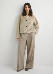 Women's short beige fur coat FUTDP-0079-1A(W26), front view of the product on the model. Full body visible.